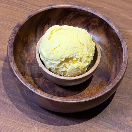 Mango Alphonso ice cream in a wooden bowl