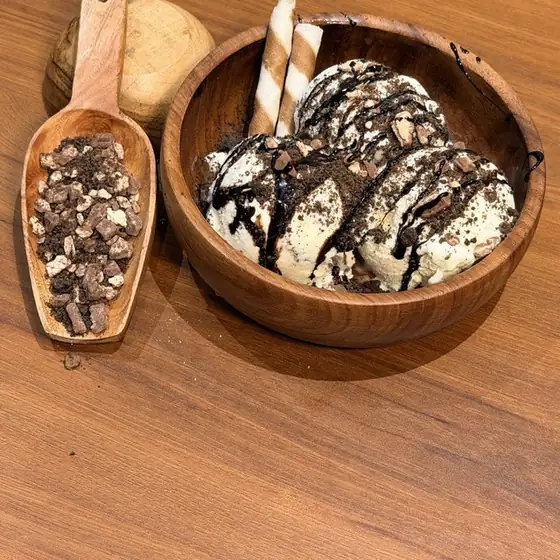 Oreo KitKat sundae in a wooden bowl