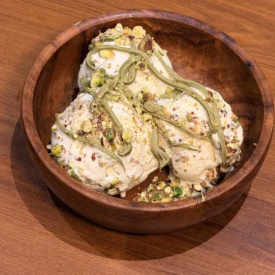 Pistachio Royale sundae in a wooden bowl