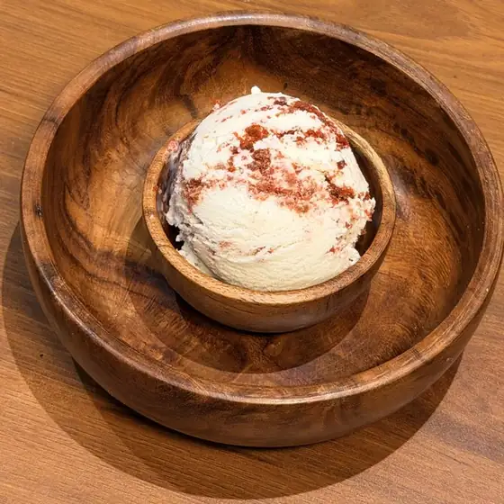 Red Velvet ice cream in a wooden bowl