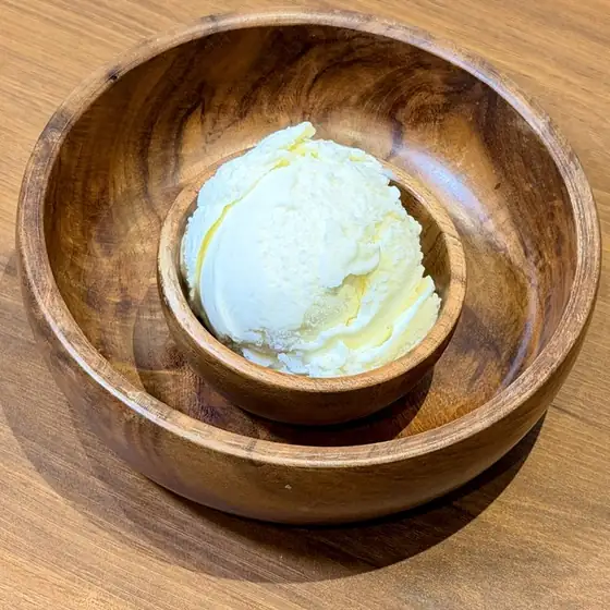Vanilla ice cream in a wooden bowl
